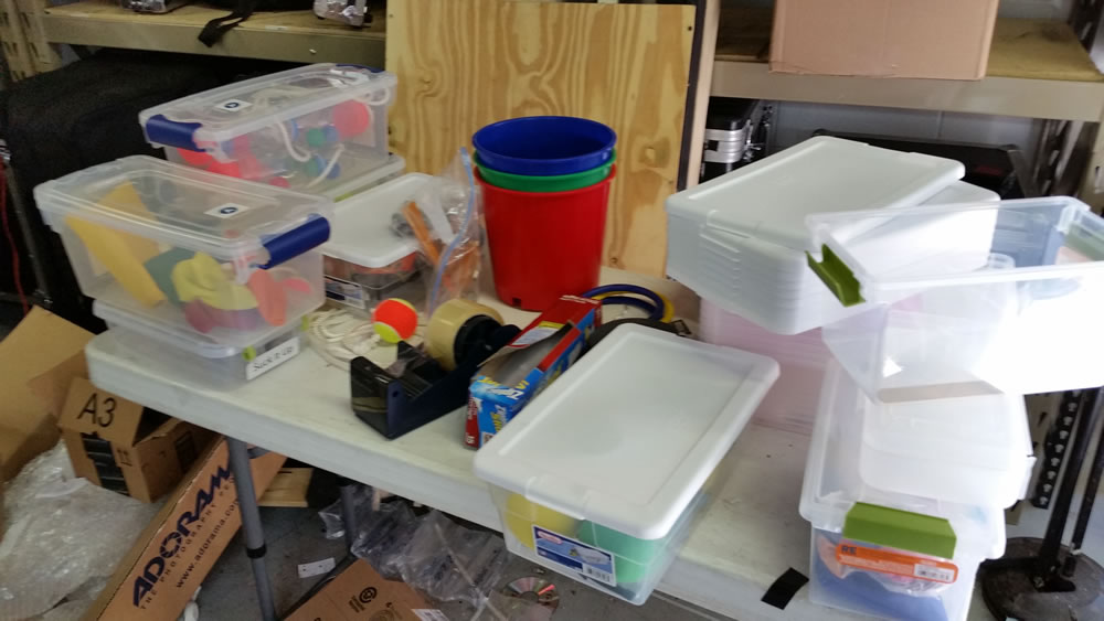 Prepping for our new Win It In A Minute games. We collect props, triplicate them, put them in boxes, label, flight case, and then script them. Not as easy as it looks. 